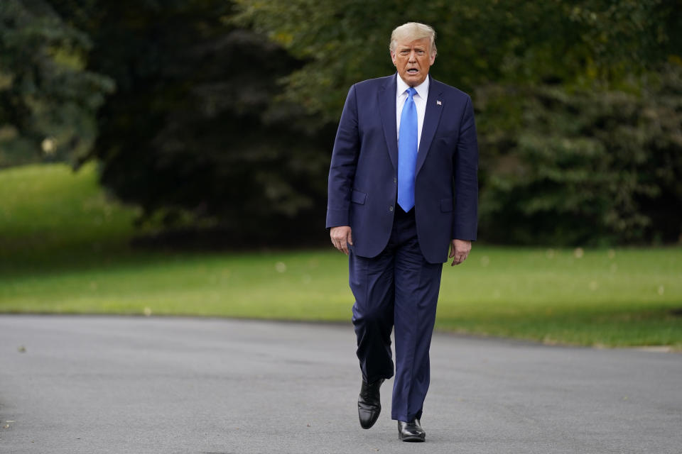President Donald Trump walks to speak to members of the press on the South Lawn of the White House in Washington, Thursday, Sept. 24, 2020, before boarding Marine One for a short trip to Andrews Air Force Base, Md. Trump is traveling to North Carolina and Florida. (AP Photo/Patrick Semansky)