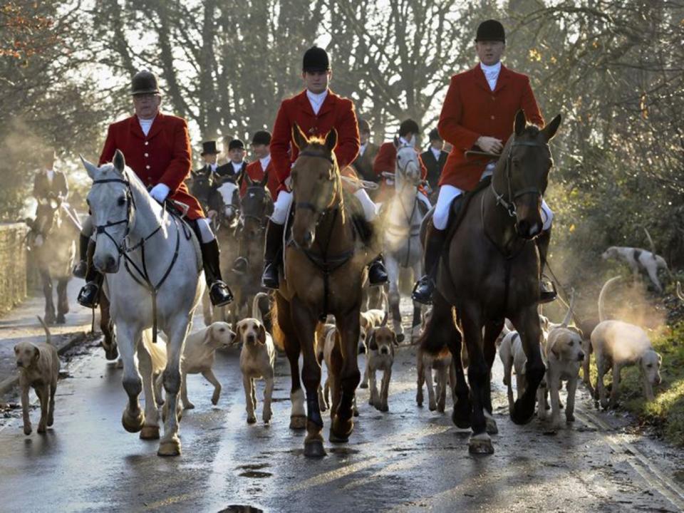 Avon Vale hunt making its way to the village of Laycock, Wiltshire (PA)