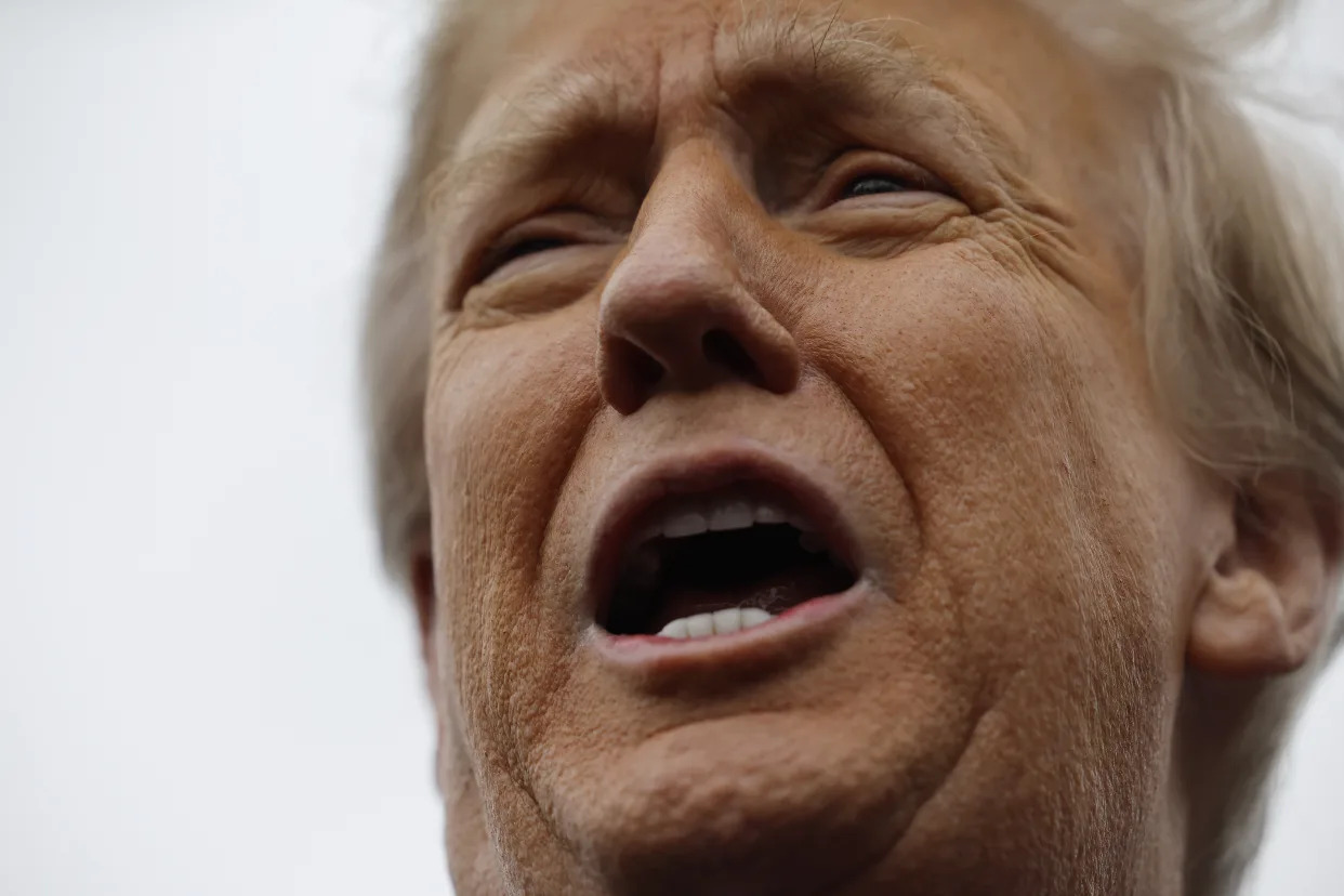 Former President Donald Trump tells people to go back inside and vote as he visits the polling site at Londonderry High School on January 23, 2024 in Londonderry, New Hampshire. (Chip Somodevilla/Getty Images)