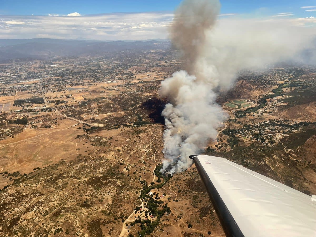 The Bunnie Fire near Ramona, California, is seen from the air on 9 August, 2023 (Cal Fire / San Diego County Fire)