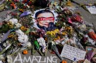 People gather to mourn the death of Associate Justice Ruth Bader Ginsburg, at the Supreme Court in Washington