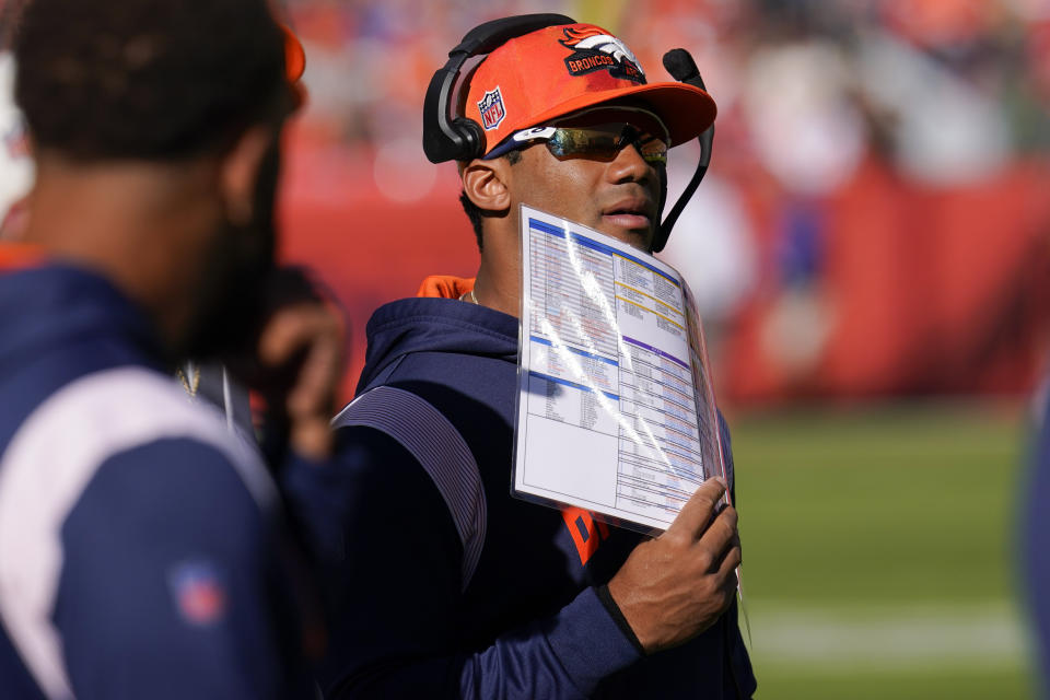 Denver Broncos quarterback Russell Wilson watches play against the New York Jets during the first half of an NFL football game, Sunday, Oct. 23, 2022, in Denver. Wilson didn't play due to injury. (AP Photo/Matt York)