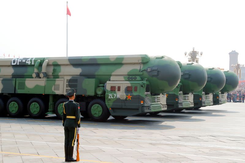 FILE PHOTO: Military vehicles carrying DF-41 intercontinental ballistic missiles travel during the military parade in Beijing