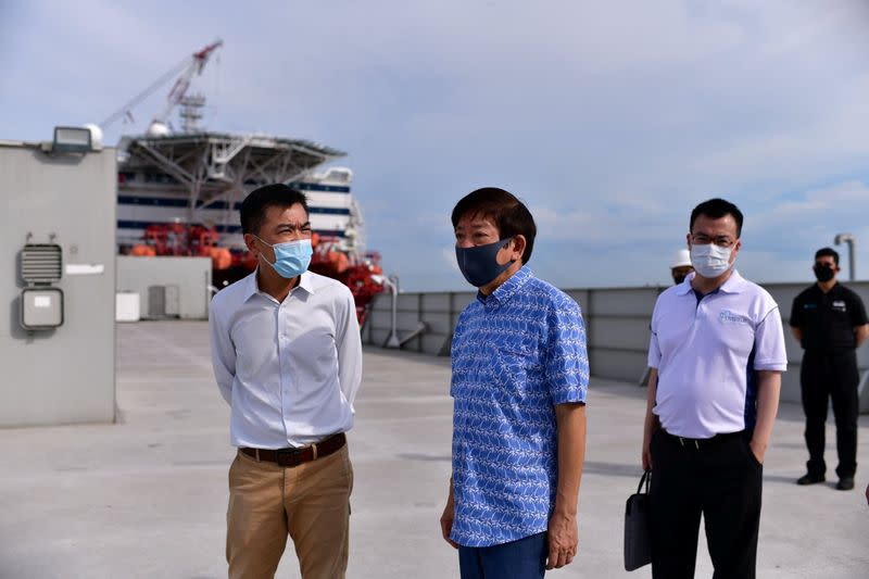 Singapore's Transport Minister Khaw Boon Wan is seen onboard a floating accommodation docked at Tanjong Pagar Terminal, meant to house healthy migrant workers, as the spread of the coronavirus disease (COVID-19) continues in Singapore