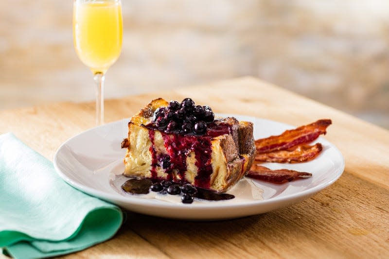 Upright French toast with blueberry compote, maple-vanilla cream, and applewood smoked bacon at Seasons 52.