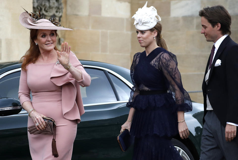 Sarah, Duchess of York (L) waves as she arrives with Britain's Princess Beatrice of York (C) and Edoardo Mapelli Mozzi at St George's Chapel in Windsor Castle, Windsor, west of London, on May 18, 2019, to attend the wedding of Lady Gabriella Windsor to Thomas Kingston. - Lady Gabriella, is the daughter of Prince and Princess Michael of Kent. Prince Michael, is the Queen Elizabeth II's cousin. (Photo by Frank Augstein / POOL / AFP)        (Photo credit should read FRANK AUGSTEIN/AFP via Getty Images)