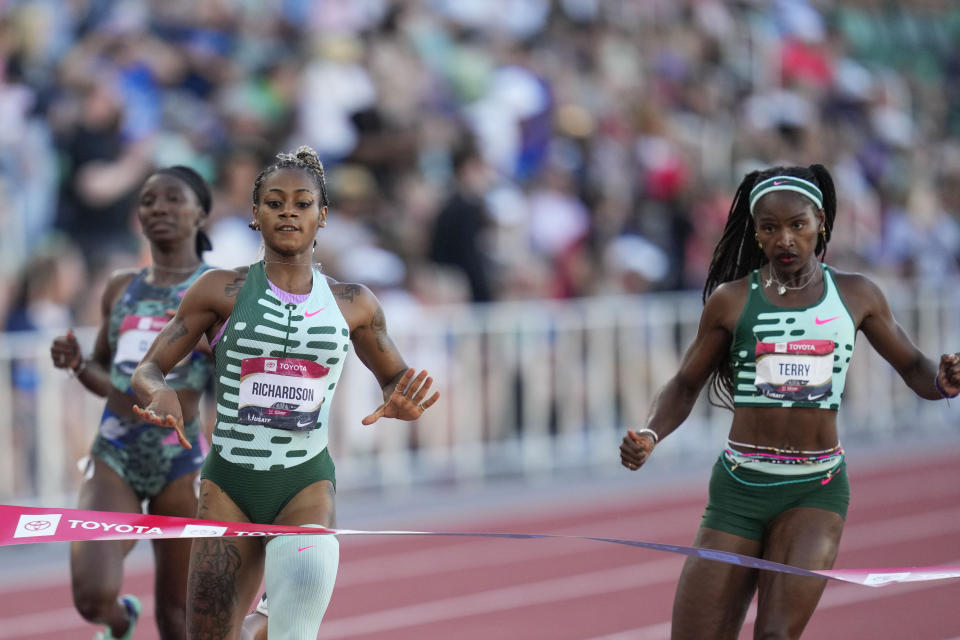 Sha'Carri Richardson nears the finish line to take second place in the women's 200 meters final during the U.S. track and field championships in Eugene, Ore., Sunday, July 9, 2023. Right is Twanisha Terry who finished fifth. (AP Photo/Ashley Landis)