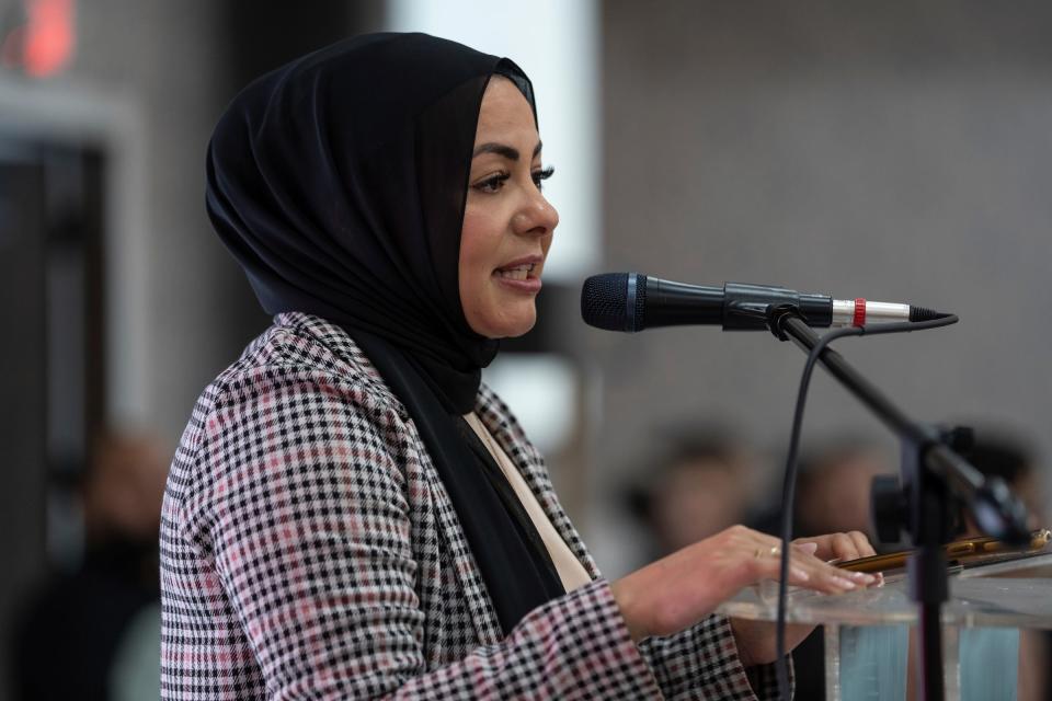 Chef Amanda Saab speaks to the crowd during the Chefs for Palestine event at the Bint Jebail Cultural Center in Dearborn.