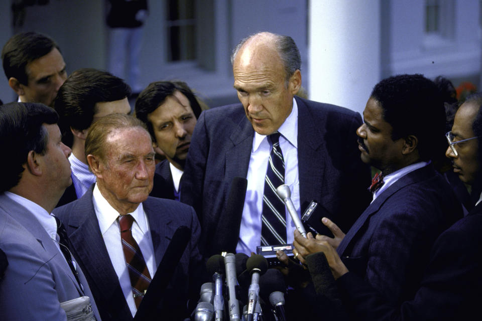 Senators J. Strom Thurmond and Alan Simpson walking through a mob of reporters after a White House meeting concerning Robert H. Bork’s Supreme Court nomination. (Photo: Diana Walker//Time & Life Pictures/Getty Images)