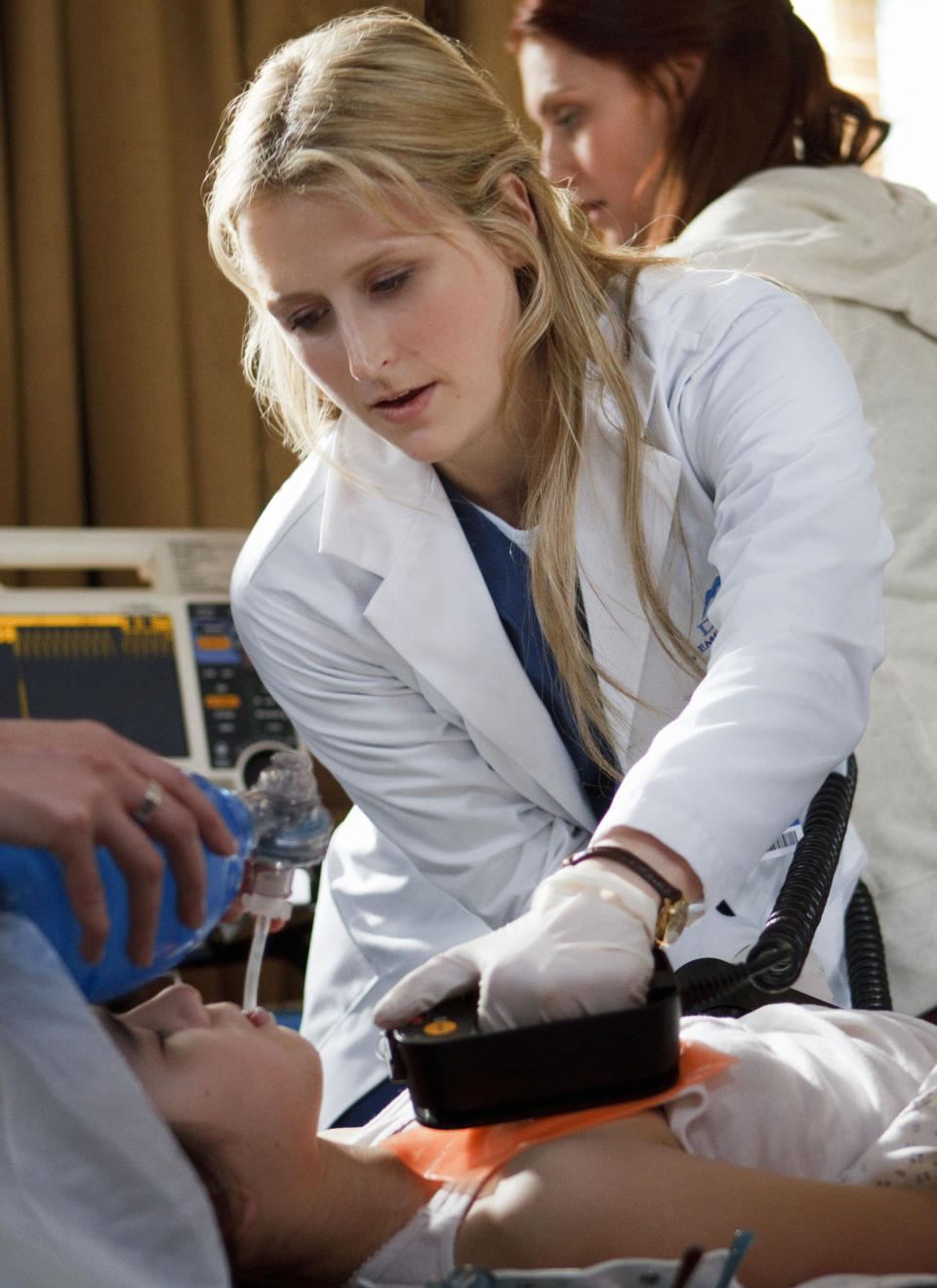 This image released by the CW shows Mamie Gummer in the title role in "Emily Owens M.D.," premiering Oct. 16, at 9 p.m. EST. (AP Photo/The CW, Michael Courtney)