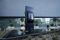 People stand beside the sculpture titled History of Suspended Time at an entrance to the Fontainebleau Las Vegas hotel-casino Tuesday, Dec. 12, 2023, in Las Vegas. The property is scheduled to open Wednesday. (AP Photo/John Locher)