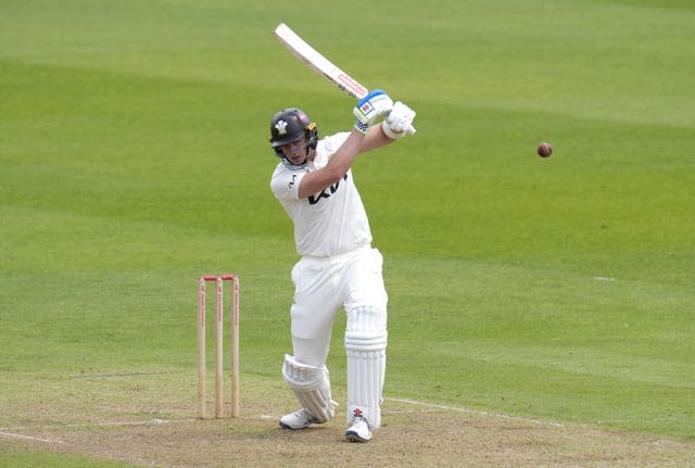 Surrey's Jamie Smith hits over mid-off against Hampshire