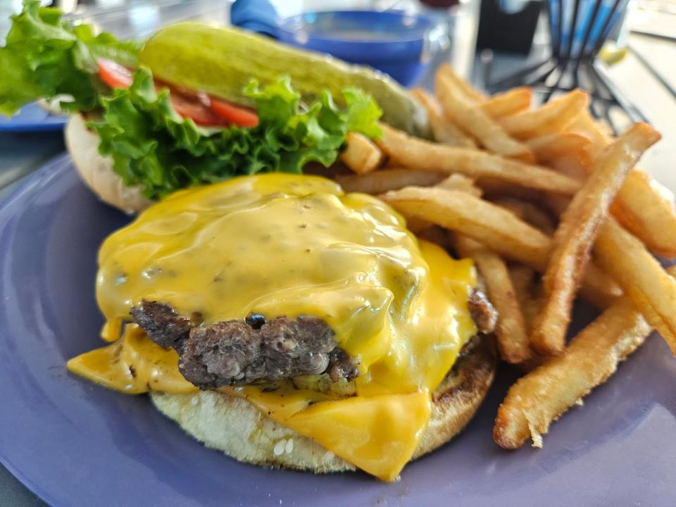 Double Angus Cheeseburger with American cheese at Marina Jack, 2 Marina Plaza, Sarasota, photographed Sept. 17, 2023.