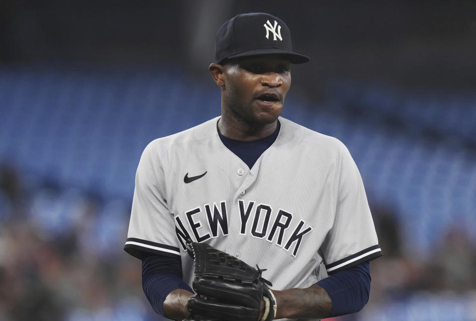 New York Yankees starting pitcher Domingo German walks off the field following the second inning of the team's baseball game against the Toronto Blue Jays on Tuesday, May 16, 2023, in Toronto. (Chris Young/The Canadian Press via AP)