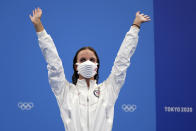 Regan Smith of the United States waves as she stands on the podium to receive her bronze medal for the women's 100-meter backstroke at the 2020 Summer Olympics, Tuesday, July 27, 2021, in Tokyo, Japan. (AP Photo/Matthias Schrader)