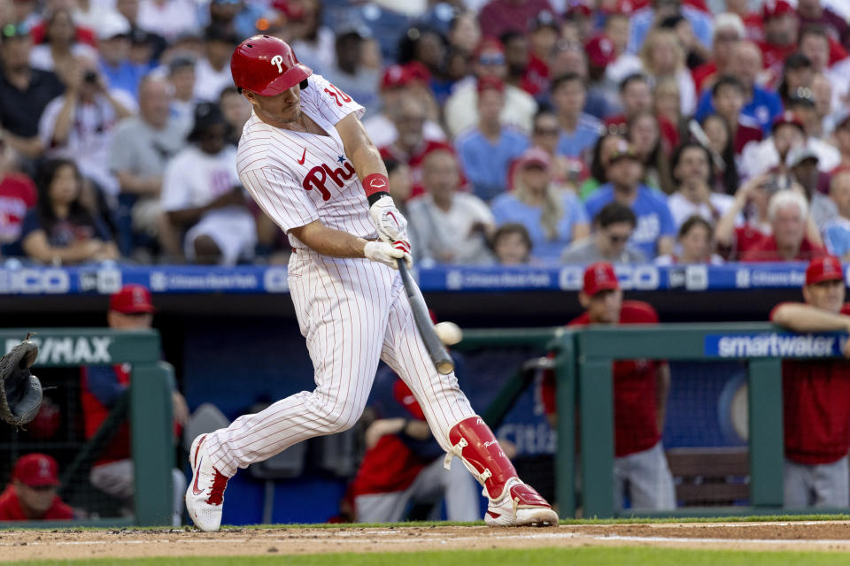 Philadelphia Phillies' J.T. Realmuto hits a two-run double during the first inning of the team's baseball game against the Los Angeles Angels, Saturday, June 4, 2022, in Philadelphia. (AP Photo/Laurence Kesterson)