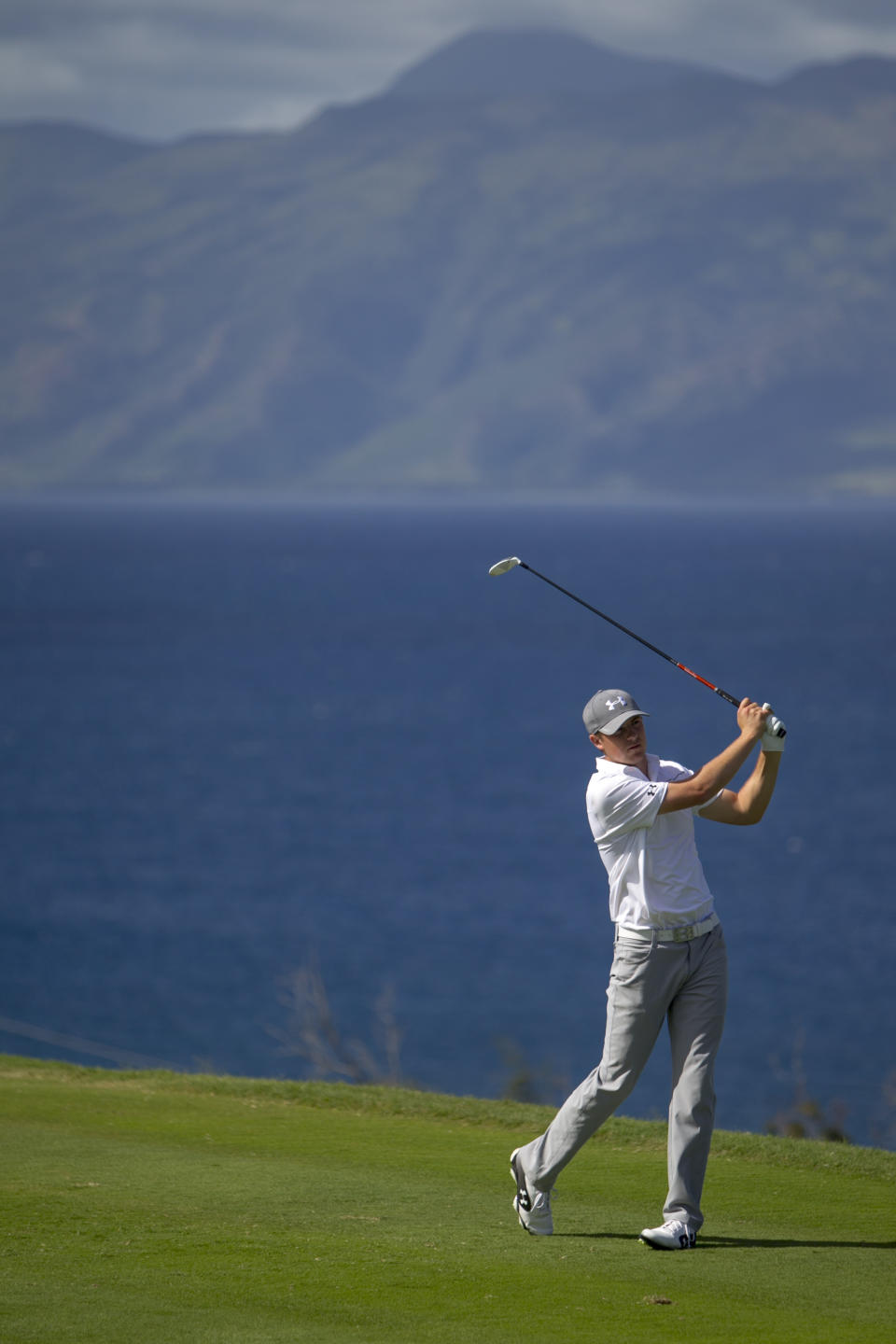 Jordan Spieth drives on the 13th green during the final round of the Tournament of Champions golf tournament, Monday, Jan. 6, 2014, in Kapalua, Hawaii. (AP Photo/Marco Garcia)