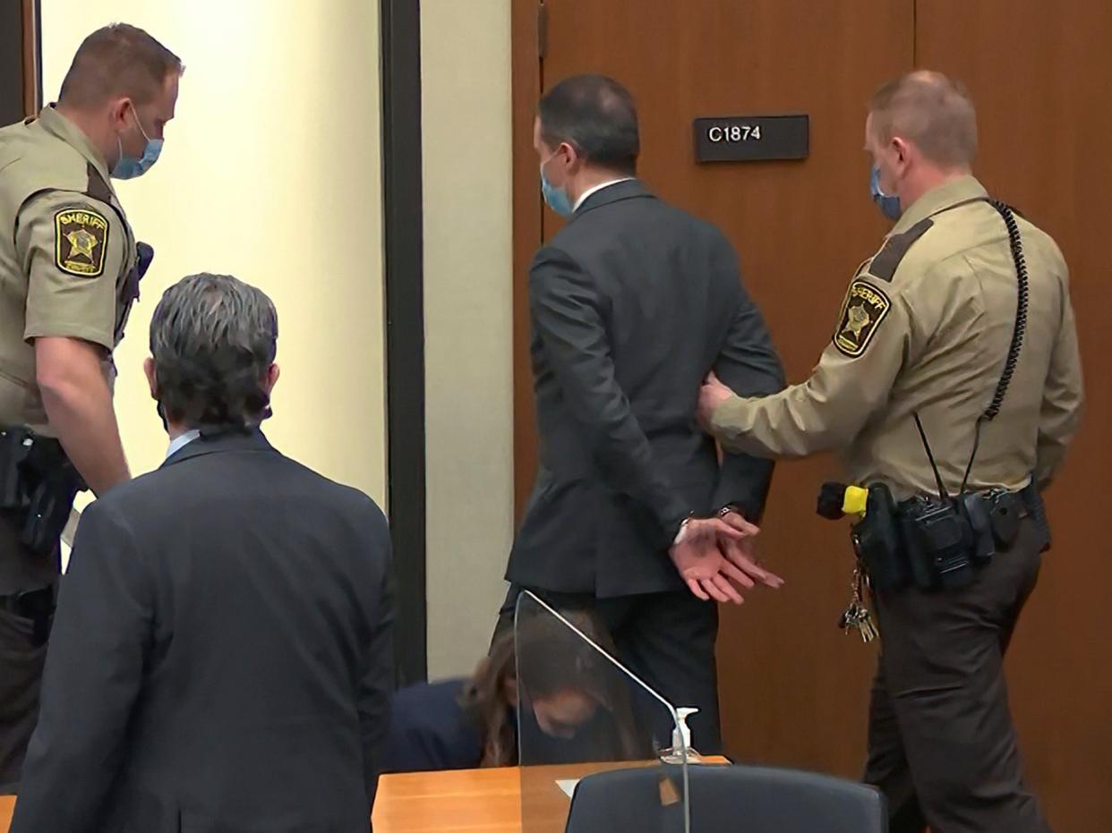 <p>Derek Chauvin listens to the guilty verdict being read by judge Peter Cahill</p> ((Associated Press))