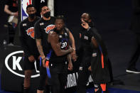 New York Knicks forward Julius Randle (30) reacts with teammates after making a 3-point basket during overtime of an NBA basketball game against the New Orleans Pelicans on Sunday, April 18, 2021, in New York. (AP Photo/Adam Hunger, Pool)