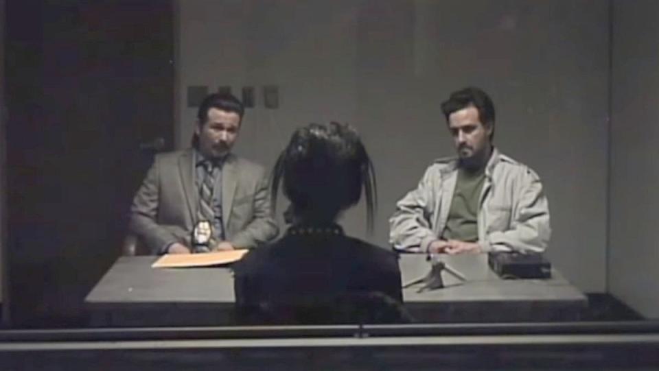 Freddy Rodriguez and James Ransome sit across from a goth kid in a police interrogation room in V/H/S/85.