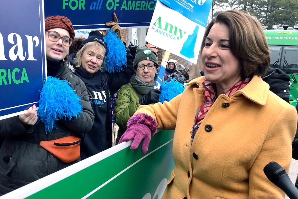 Democratic presidential candidate Sen. Amy Klobuchar, D-Minn., greets supporters outside a New Hampshire primary polling location, Tuesday, Feb. 11, 2020, in Manchester, N.H.