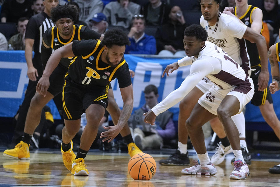 Pittsburgh's Nelly Cummings (0) makes a steal against Mississippi State's Dashawn Davis (10) during the first half of a First Four game in the NCAA men's college basketball tournament Tuesday, March 14, 2023, in Dayton, Ohio. (AP Photo/Darron Cummings)