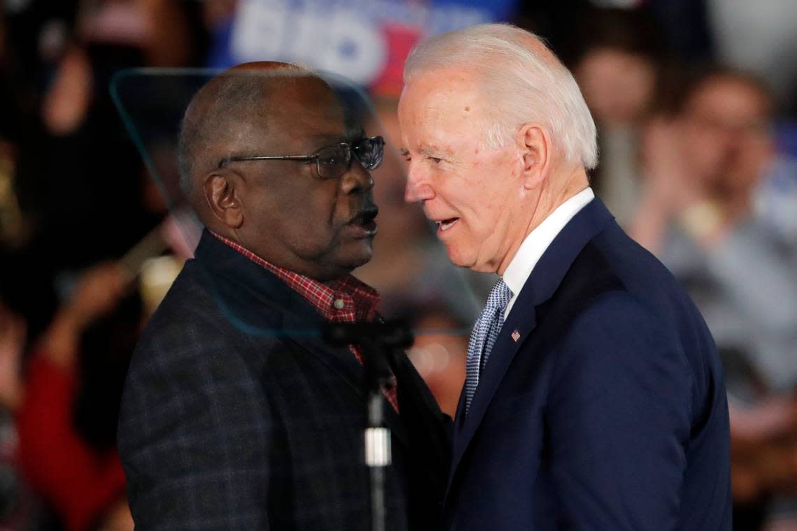 Then-Democratic presidential candidate Joe Biden talks to Rep. James Clyburn, D-S.C., at a primary night election rally in Columbia, S.C., Feb. 29, 2020 after winning the South Carolina primary. President Biden has frequently referenced the critical role South Carolina played in his nomination. He points to his decades-long relationship with the state whose Black voters handed him a major win at a desperate time for his Democratic campaign. But, in recent interviews with The Associated Press, some Black voters in South Carolina who supported Biden reluctantly — or not at all — say they’re unimpressed and even dispirited. (AP Photo/Gerald Herbert)