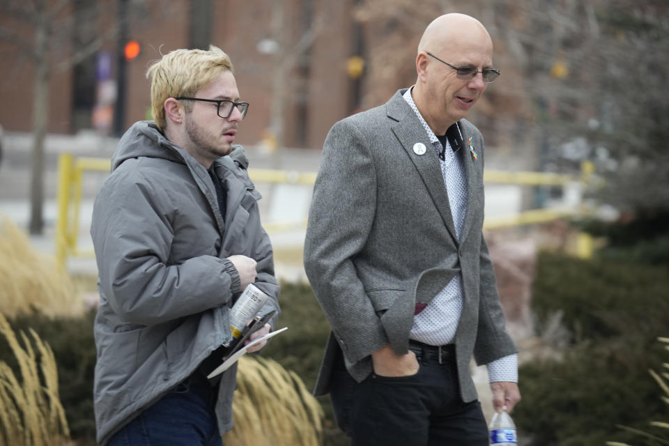 Michael Anderson, left, a survivor of the mass shooting at Club Q, walks with the club's co-owner, Matthew Haynes, into the El Paso County courthouse for a preliminary hearing for Anderson Lee Aldrich, the alleged shooter in the Club Q mass shooting Wednesday, Feb. 22, 2023, in Colorado Springs, Colo. (AP Photo/David Zalubowski)