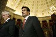 U.S. House Majority Leader Eric Cantor (R-VA) (C) walks to the House floor for a series of late-night votes Saturday session at the U.S. Capitol in Washington, September 29, 2013. The House of Representatives early Sunday, ignoring a White House veto threat, approved a one-year delay in funding major provisions of President Barack Obama's landmark healthcare law as part of a government funding bill. REUTERS/Jonathan Ernst