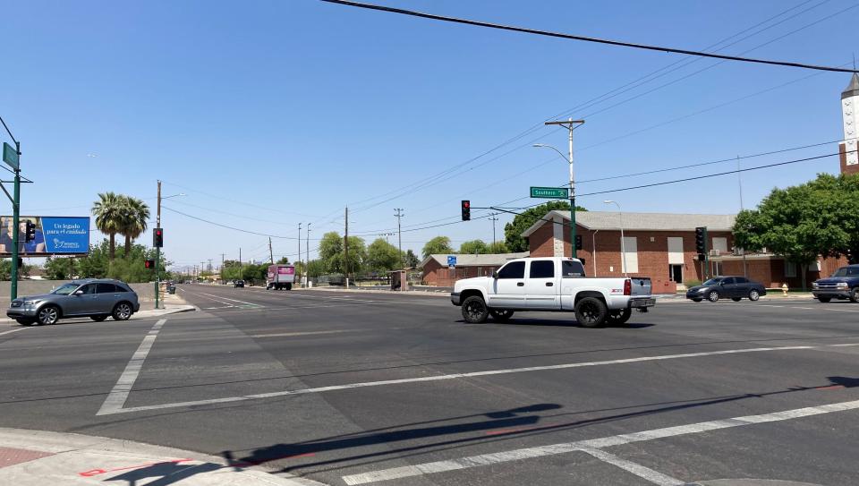 The white truck, the first and only vehicle waiting to make a left turn from Seventh Avenue onto Southern Avenue in Phoenix, had to wait to turn on red because of traffic on April 27, 2022. Residents say current signals at Seventh and Southern avenues are "useless" for controlling traffic.