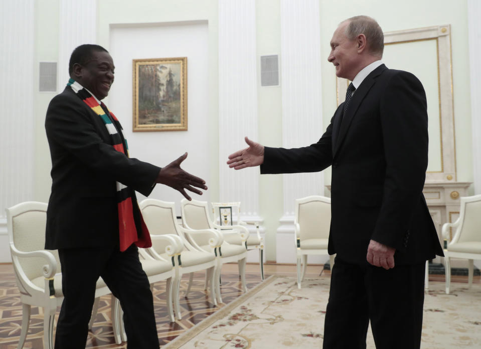 Russian President Vladimir Putin, right, and Zimbabwe's President Emmerson Dambudzo Mnangagwa shake hands during their meeting in Moscow, Russia, Tuesday, Jan. 15, 2019. (Sergei Chirikov/Pool Photo via AP)