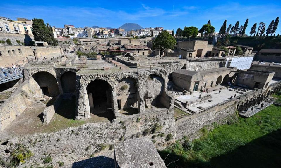 The Herculaneum archaeological site in Ercolano, near Naples, with Vesuvius in the background.