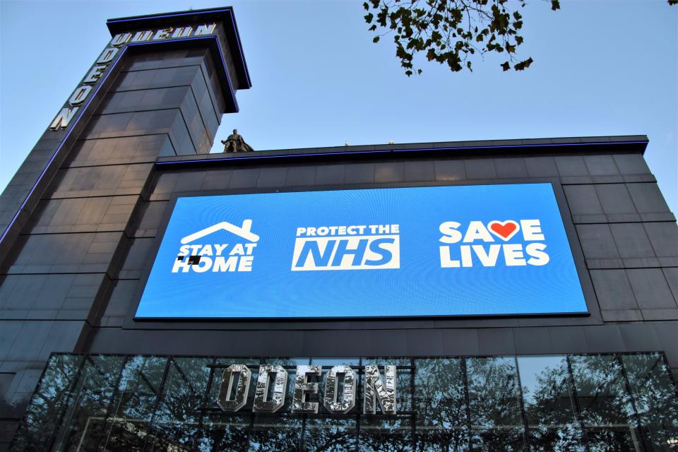 LONDON, UNITED KINGDOM - 2020/11/10: Stay at Home, Protect The NHS, Save Lives sign seen at the closed Odeon cinema in Leicester square. Most shops, restaurants and businesses have closed as the second month-long nationwide Covid 19 lockdown begins in England. (Photo by Vuk Valcic/SOPA Images/LightRocket via Getty Images)