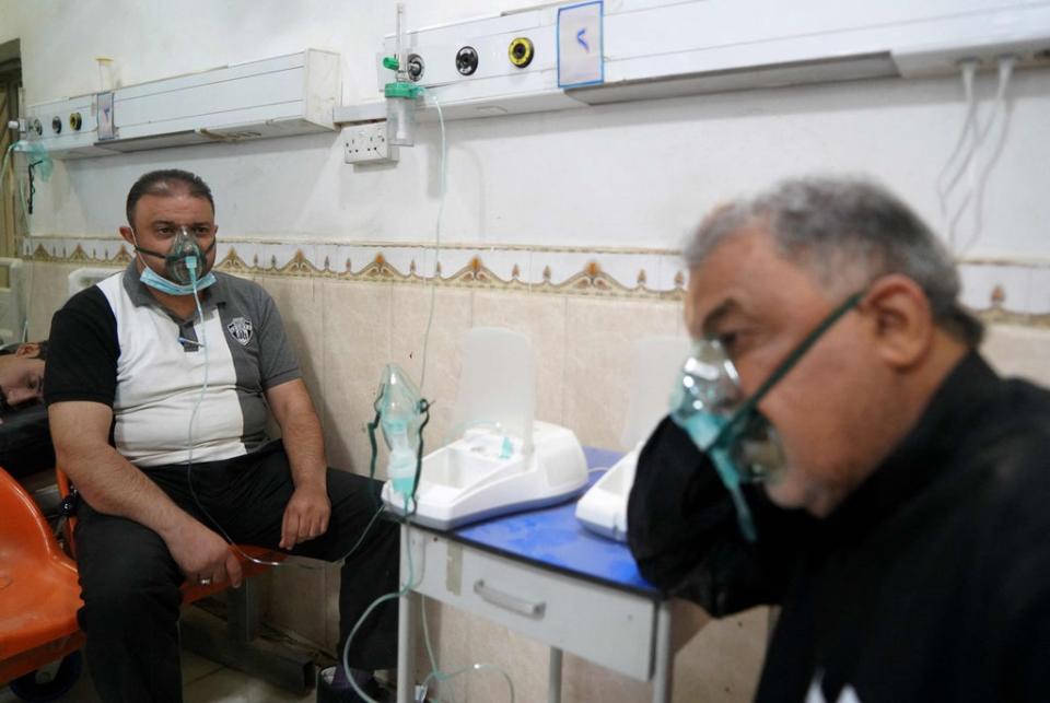 Patients receive medical care at the al-Hakim hospital  during a sandstorm in Iraq’s holy city of Najaf on 16 May 2022 (AFP via Getty)