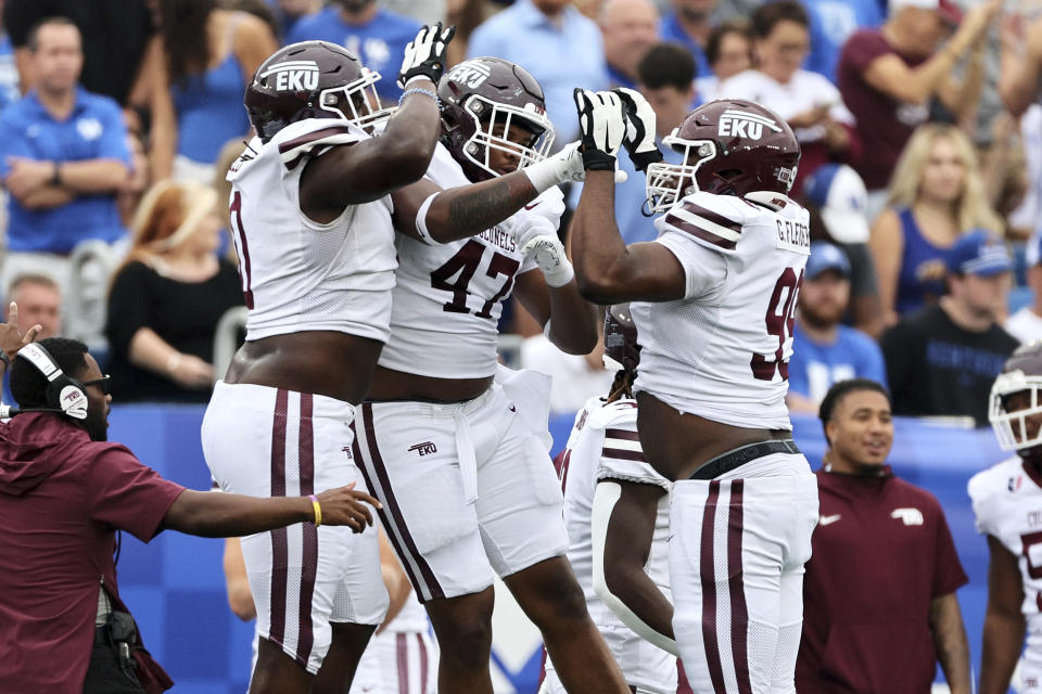 Eastern Kentucky defensive lineman Marvion Field (0), defensive lineman Jeremiah Bailey (47), and defensive lineman Gabe Fletcher (99) celebrate during the first half of an NCAA college football game against Kentucky in Lexington, Ky., Saturday, Sept. 9, 2023. (AP Photo/Michelle Haas Hutchins)