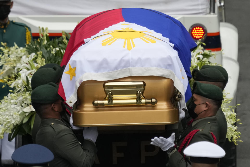 Pallbearers carry the flag-draped casket of the late former Philippine President Fidel Ramos during his state funeral at the Heroes' Cemetery in Taguig, Philippines on Tuesday Aug. 9, 2022. Ramos was laid to rest in a state funeral Tuesday, hailed as an ex-general, who backed then helped oust a dictatorship and became a defender of democracy and can-do reformist in his poverty-wracked Asian country. (AP Photo/Aaron Favila)