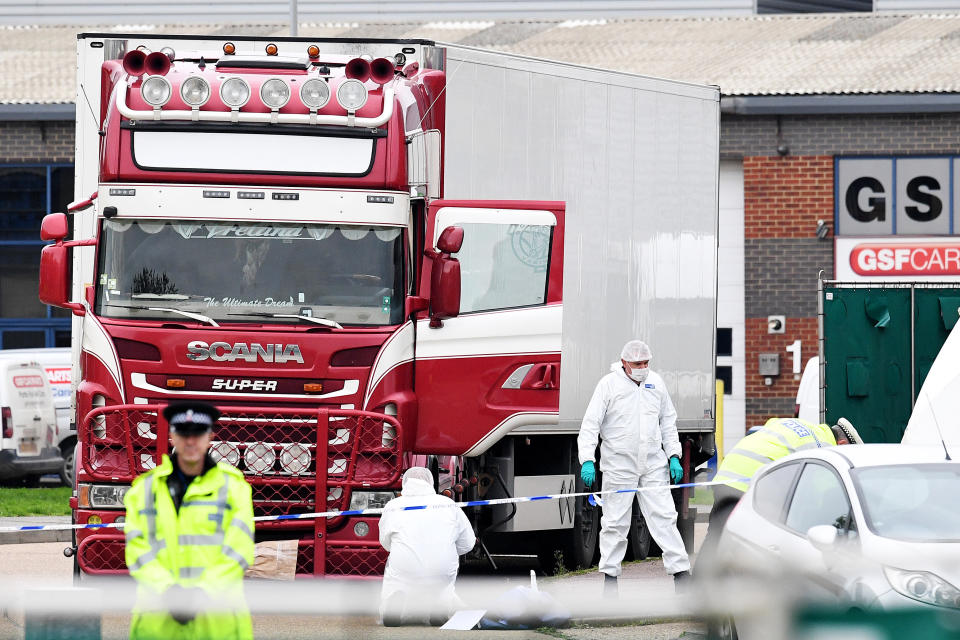 THURROCK, ENGLAND - OCTOBER 23: Police and forensic officers investigate a lorry in which 39 bodies were discovered in the trailer, as they prepare move the vehicle from the site on October 23, 2019 in Thurrock, England. The lorry was discovered early Wednesday morning in Waterglade Industrial Park on Eastern Avenue in the town of Grays. Authorities said they believed the lorry originated in Bulgaria. (Photo by Leon Neal/Getty Images)