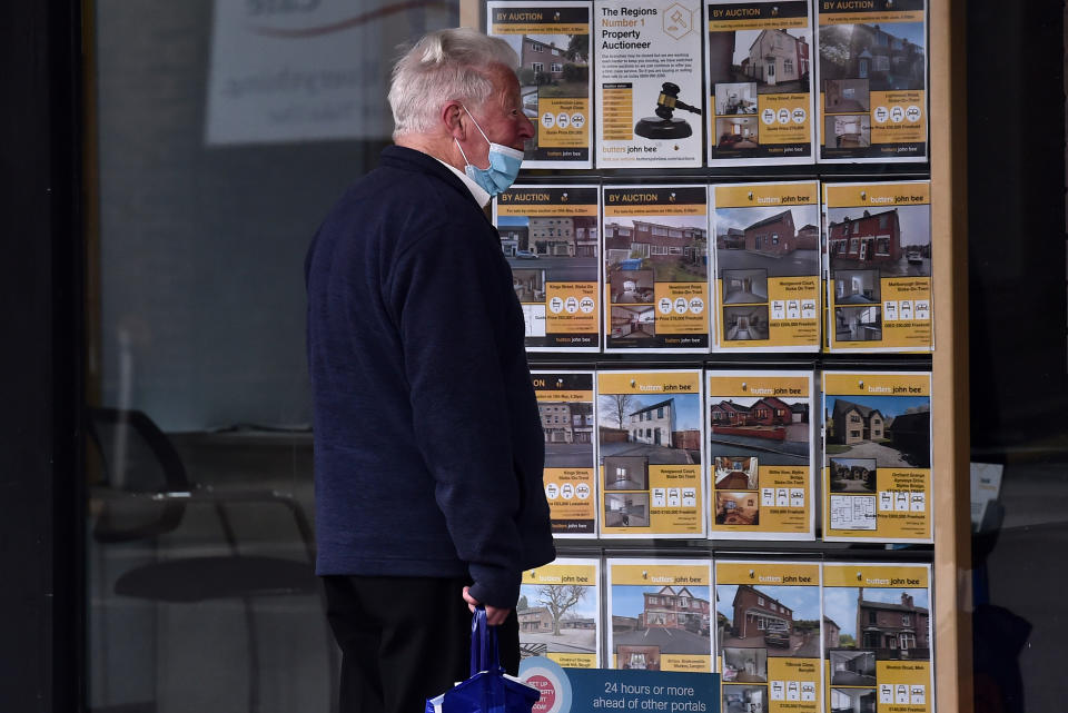 STOKE-ON-TRENT-ENGLAND - MAY 05: A man is seen looking at houses for sale at an estate agents on May 05, 2021 in Stoke-on-Trent, England . (Photo by Nathan Stirk/Getty Images) (Photo by Nathan Stirk/Getty Images)