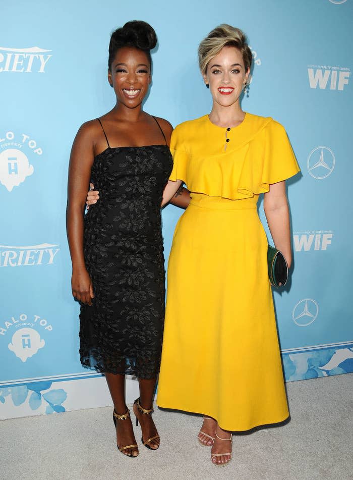 Samira Wiley and Lauren Morelli smiling on the red carpet