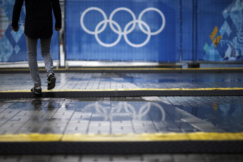 Cable protectors lie across a walkway next to the Iceberg Skating Palace at the 2014 Winter Olympics, Tuesday, Feb. 18, 2014, in Sochi, Russia. After $51 billion, it should be easy to get around at the Olympics - for everyone. Organizers have repeatedly touted accessibility for people with disabilities as one of the chief lasting benefits of hosting the Winter Games in Sochi. But with less than three weeks until the Paralympics, infrastructure around Olympic Park and its venues are not entirely barrier-free. (AP Photo/David Goldman)