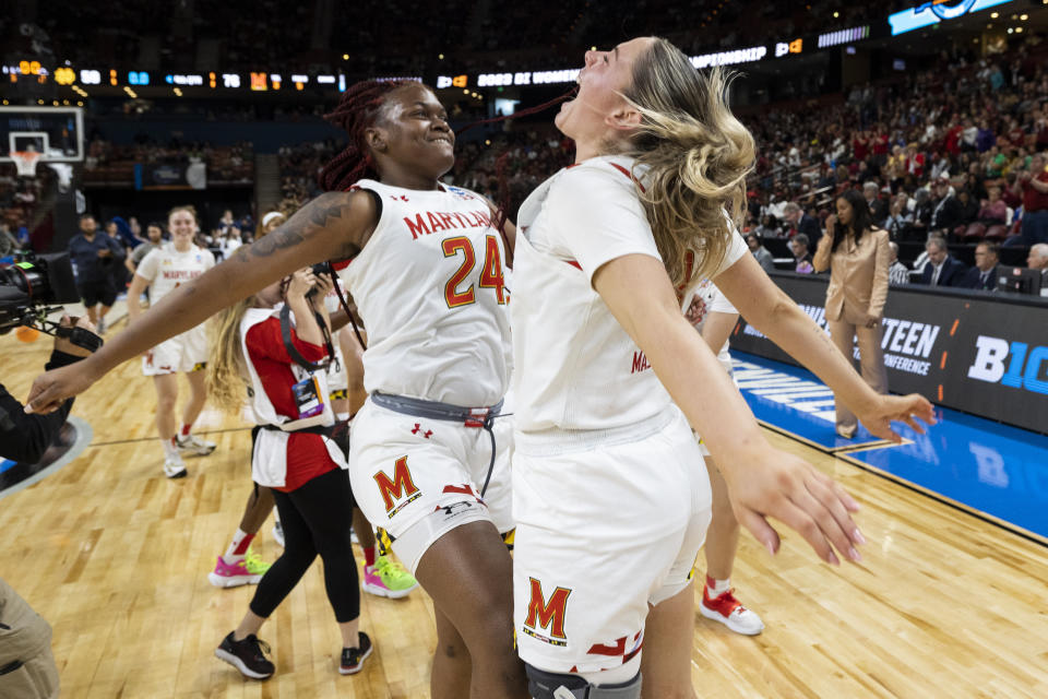 Maryland players Bri McDaniel (24) and Faith Masonius, right, celebrate their victory over Notre Dame after a Sweet 16 college basketball game at the NCAA Tournament in Greenville, S.C., Saturday, March 25, 2023. (AP Photo/Mic Smith)