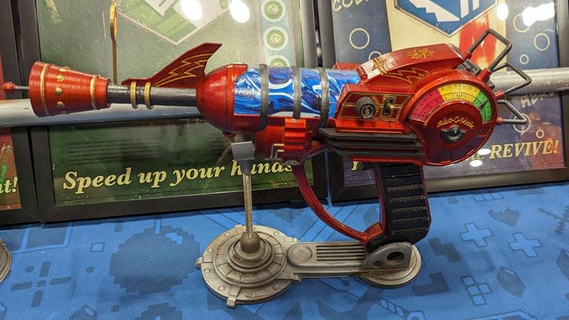 A ray gun sits on display.