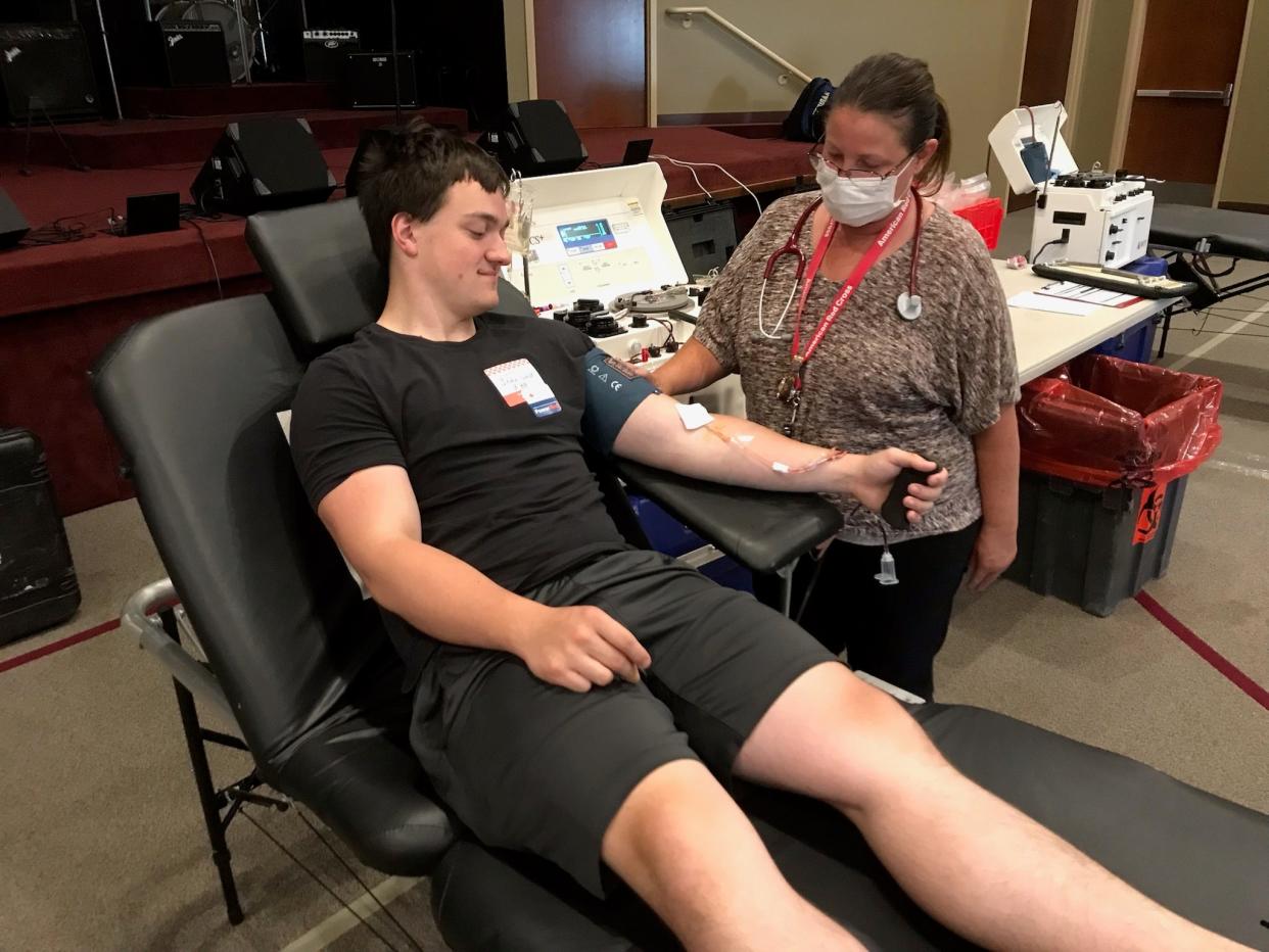 John Guldi, 17, a 2022 graduate of Jefferson High School, donates two power red blood cells during a blood drive to benefit the American Red Cross held at the Monroe Church of the Nazarene off M-50. Assisting him is Amy Hall, a phlebotomist for the Red Cross for the past seven years. Provided by Dean Cousino