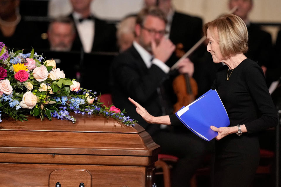 Journalist Judy Woodruff pauses at the casket after speaking at the tribute service for Rosalynn Carter at Glenn Memorial Church at Emory University in Atlanta on Nov. 28. / Credit: Brynn Anderson/Pool via REUTERS