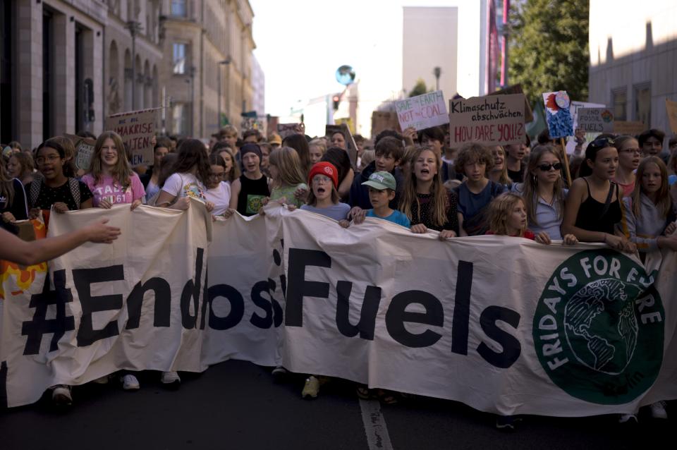 FILE - People take part in a Global Climate Strike 'Fridays For Future' protest in Berlin, Germany, Sept. 15, 2023. Nations have signed on to triple renewable energy by 2030. (AP Photo/Markus Schreiber)