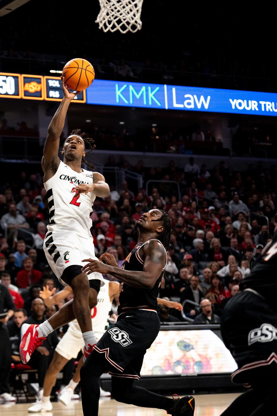 UC guard Jizzle James had 10 points against Oklahoma State. Wes Miller wants to see improved defense from the freshman guard.