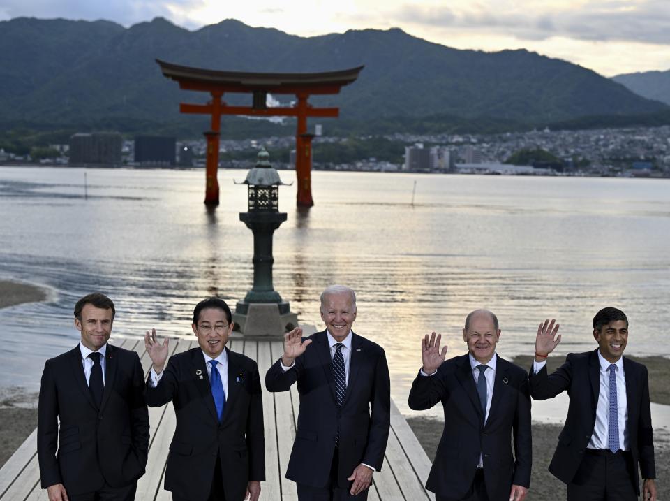 FILE - From left, France's President Emmanuel Macron, Japan's Prime Minister Fumio Kishida, U.S. President Joe Biden, Germany's Chancellor Olaf Scholz and Britain's Prime Minister Rishi Sunak visit the Itsukushima Shrine on Miyajima Island in Hatsukaichi, Hiroshima prefecture, western Japan, May 19, 2023. (Kenny Holston/Pool Photo via AP, File)