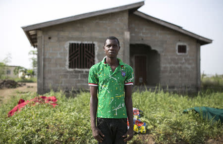 Ebola survivor Alimamy Kanu poses for a picture at Devil Hole December 17, 2014. REUTERS/Baz Ratner