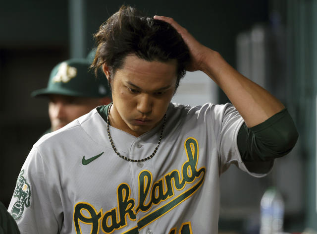 Jordan Diaz of the Oakland Athletics looks on from the dugout