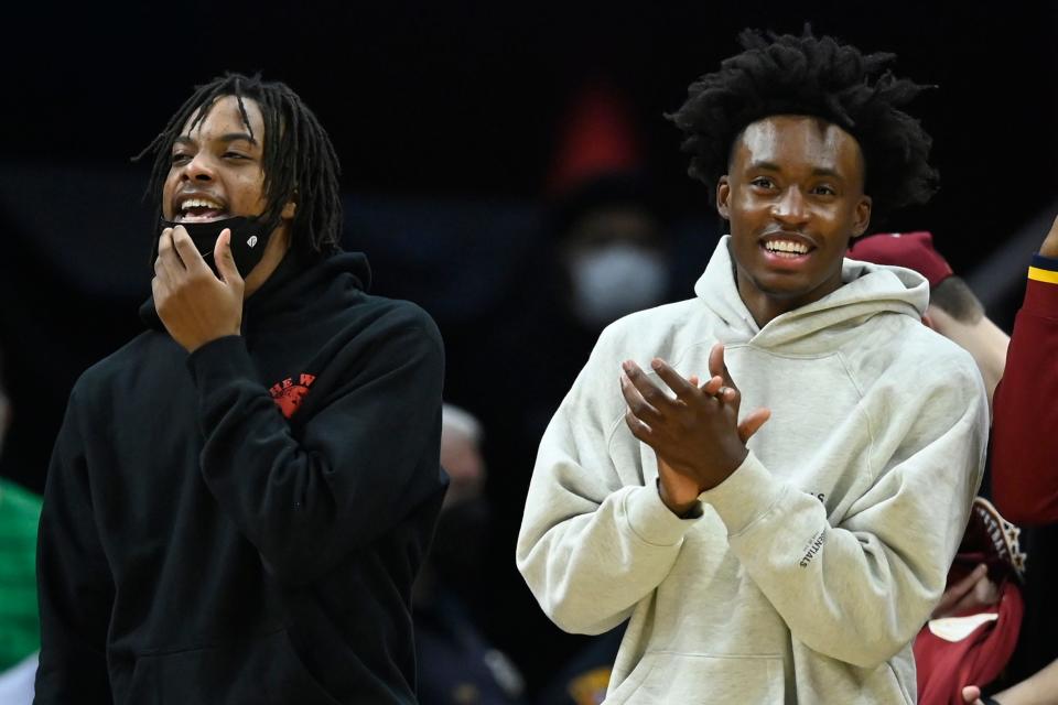 Cavaliers guards Darius Garland, left, and guard Collin Sexton react in the fourth quarter against the New Orleans Pelicans, Jan. 31, 2022, in Cleveland.